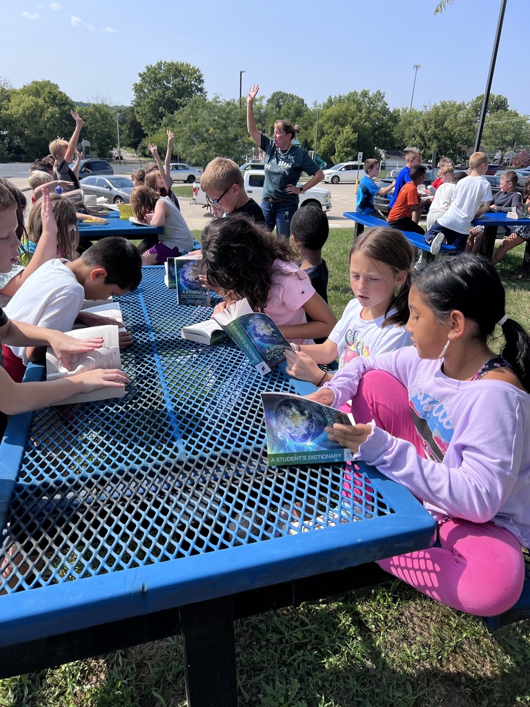 Mark Twain students enjoying their new dictionaries.