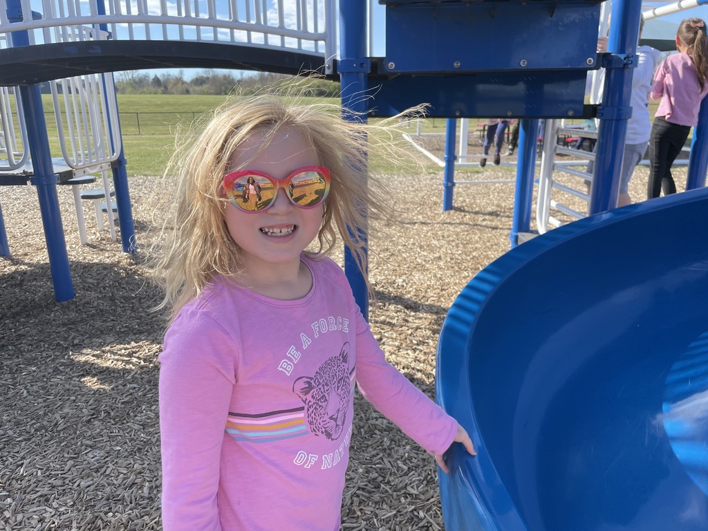 Girl with sunglasses smiling