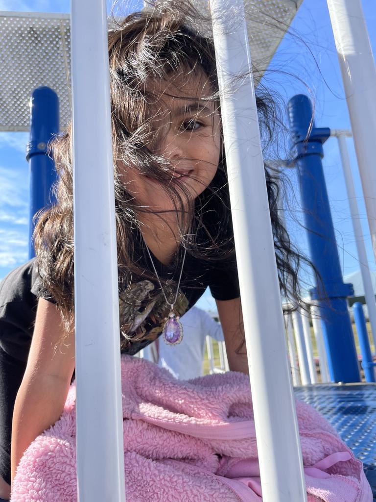 girl smiling on playground