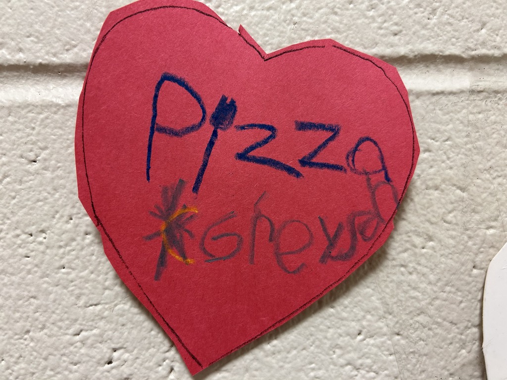 heart with writing that says "pizza"